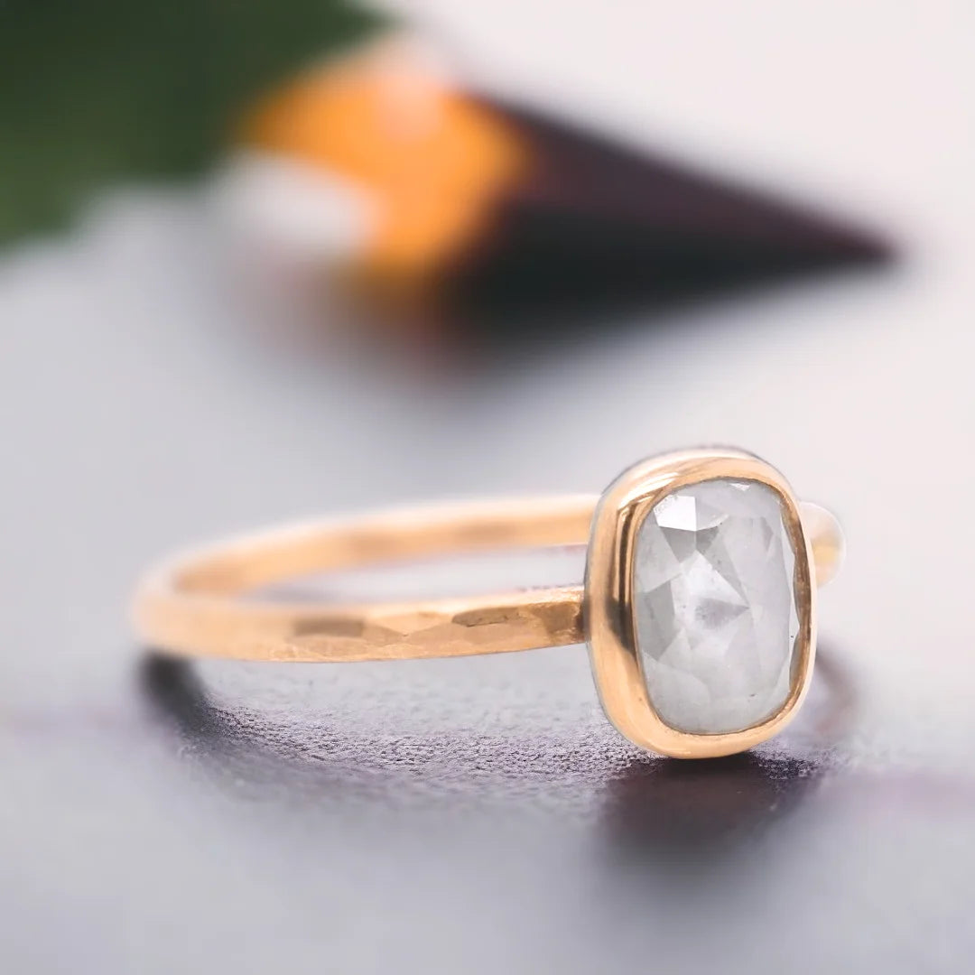 Natural Salt and Pepper Diamond Ring with Rose Cushion Cut Design featuring a cushion-cut salt-and-pepper diamond set in a straight band ring with a minimal handcrafted fine jewellery style and a soft, elegant silhouette.