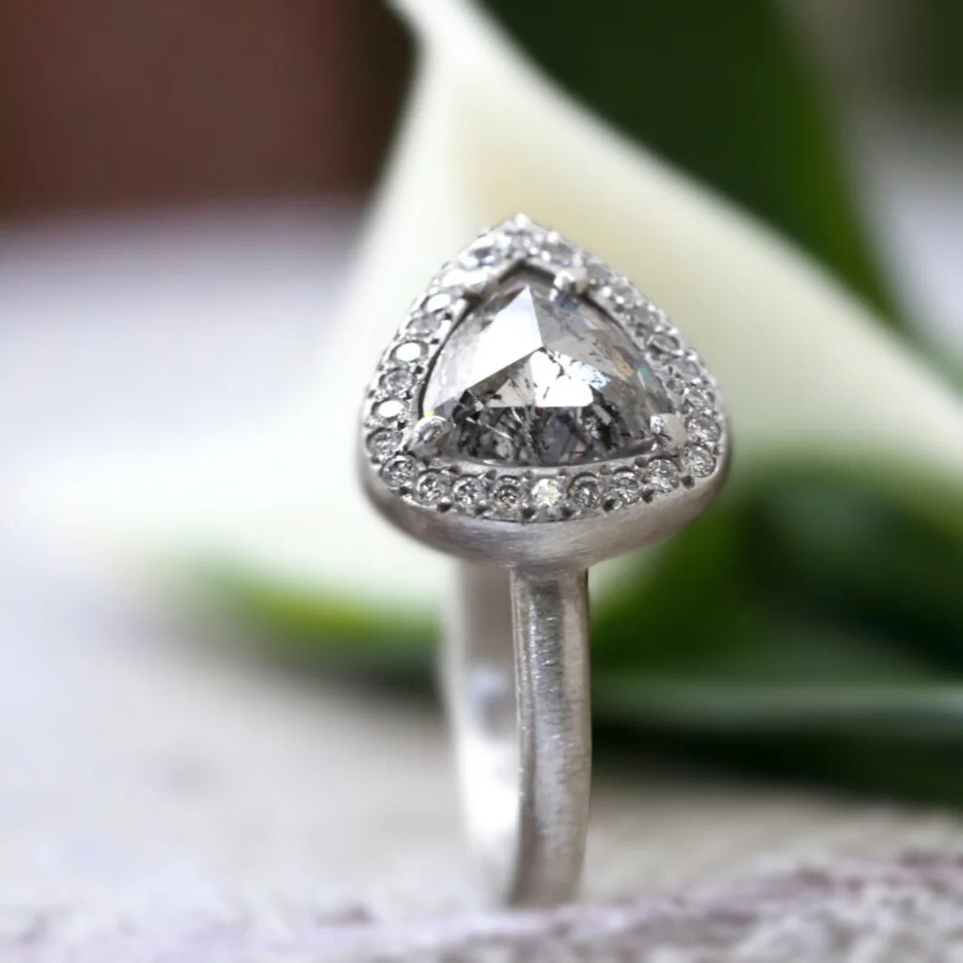 Natural Salt and Pepper Diamond Ring Triangle Cut Halo Design featuring a rose pear-cut salt and pepper diamond surrounded by a round diamond halo in a nature-inspired halo ring design with a straight shank and artisan handcrafted styling.