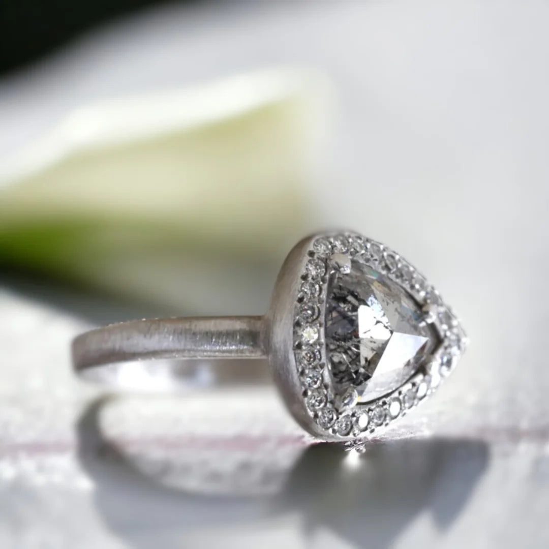 Natural Salt and Pepper Diamond Ring Triangle Cut Halo Design featuring a rose pear-cut salt and pepper diamond surrounded by a round diamond halo in a nature-inspired halo ring design with a straight shank and artisan handcrafted styling.