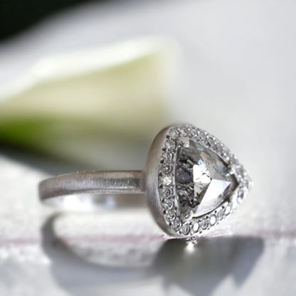 Natural Salt and Pepper Diamond Ring Triangle Cut Halo Design featuring a rose pear-cut salt and pepper diamond surrounded by a round diamond halo in a nature-inspired halo ring design with a straight shank and artisan handcrafted styling.