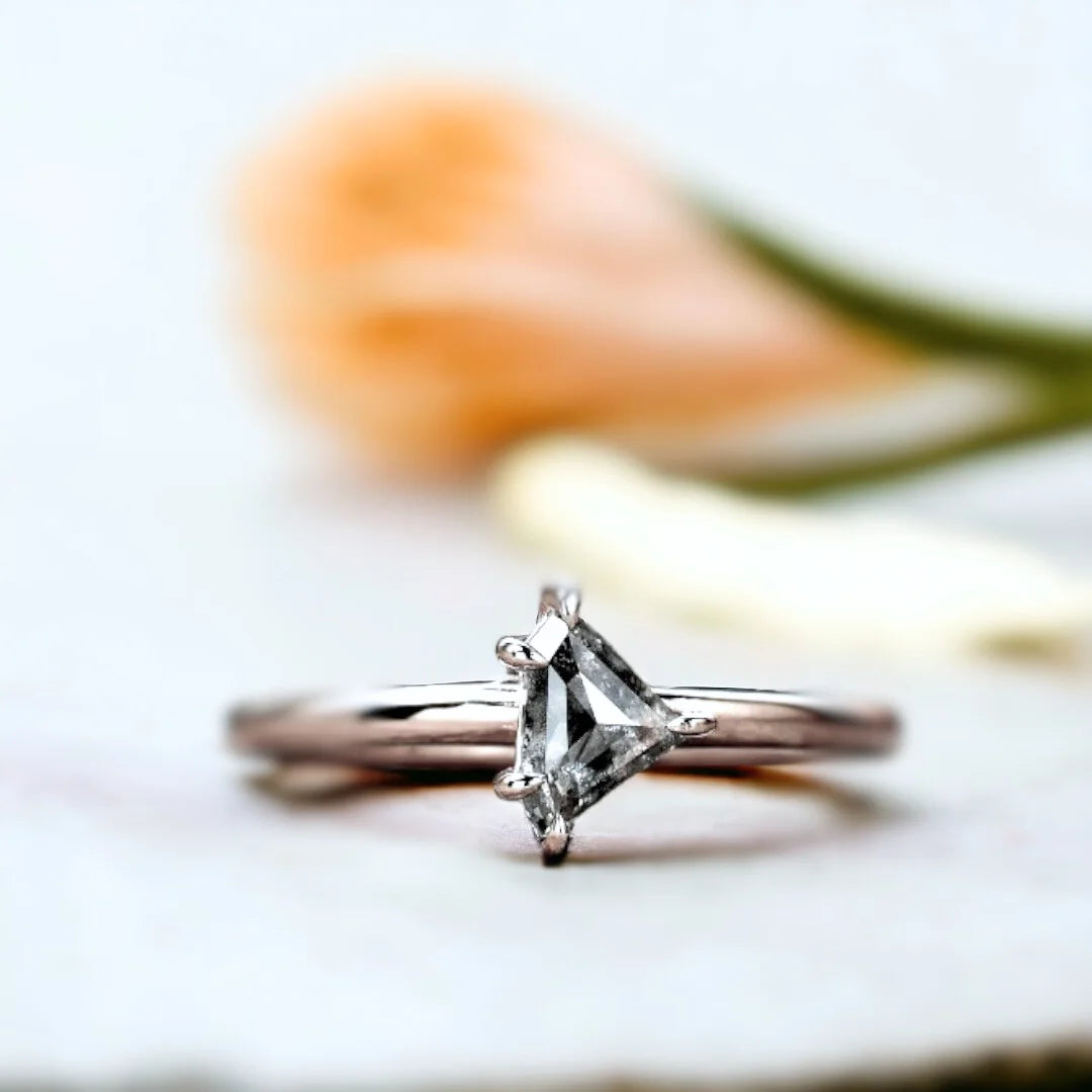 Natural Salt and Pepper Shield Diamond Ring, Elegant Minimal Design showcasing a shield-cut natural salt and pepper diamond with visible unique inclusions, set in a delicate straight band with a refined minimalist geometric silhouette and fine handmade craftsmanship.
