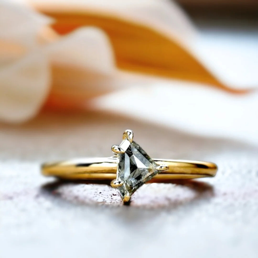Natural Salt and Pepper Shield Diamond Ring, Elegant Minimal Design showcasing a shield-cut natural salt and pepper diamond with visible unique inclusions, set in a delicate straight band with a refined minimalist geometric silhouette and fine handmade craftsmanship.