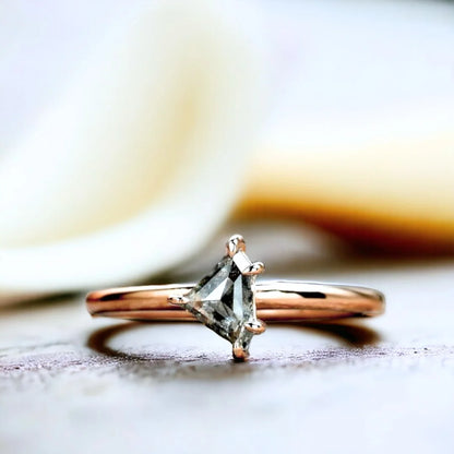 Natural Salt and Pepper Shield Diamond Ring, Elegant Minimal Design showcasing a shield-cut natural salt and pepper diamond with visible unique inclusions, set in a delicate straight band with a refined minimalist geometric silhouette and fine handmade craftsmanship.