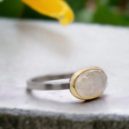 Natural Sapphire Ring With Elongated Rose Oval Sapphire featuring a natural elongated rose oval cut sapphire center stone on a handcrafted straight shank ring with an organic textured artisan design.