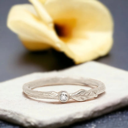 Natural White Diamond Ring Minimalist Stacking Design featuring a round cut natural white diamond on a slim straight shank band with a delicate minimalist stacking ring style and timeless everyday elegance.