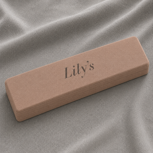 Necklace Box in a blush pink finish featuring a soft cushioned interior, necklace display insert with dual chain slots, rounded square design, and Lily's logo printed inside the lid for elegant jewelry packaging.