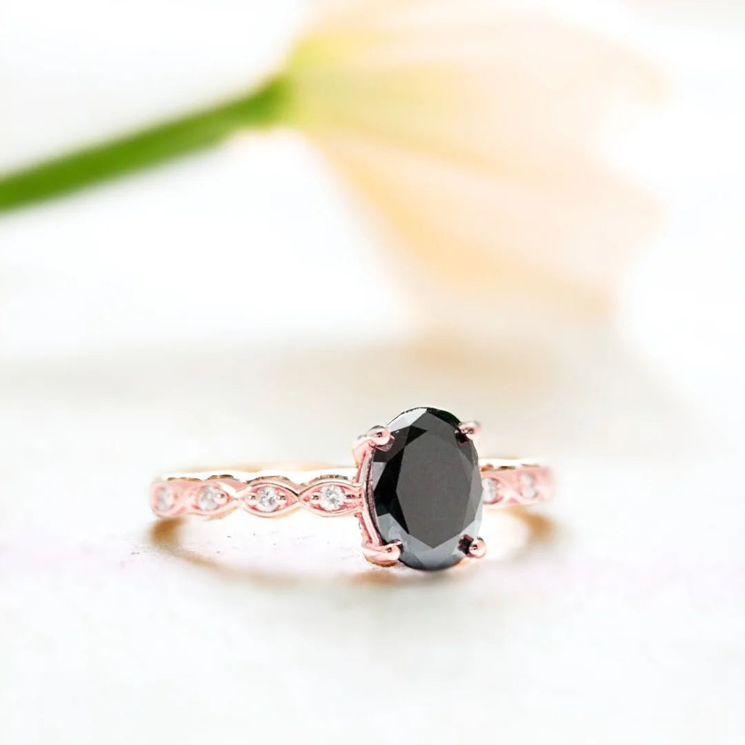 Oval Salt and Pepper Diamond Engagement Ring. Oval Salt and Pepper Diamond Engagement Ring: Round Diamond Accents featuring an oval-cut salt-and-pepper center stone with round side diamond accents in a clean, modern straight shank setting