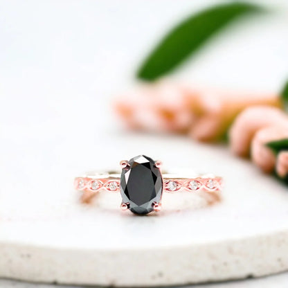 Oval Salt and Pepper Diamond Engagement Ring. Oval Salt and Pepper Diamond Engagement Ring: Round Diamond Accents featuring an oval-cut salt-and-pepper center stone with round side diamond accents in a clean, modern straight shank setting