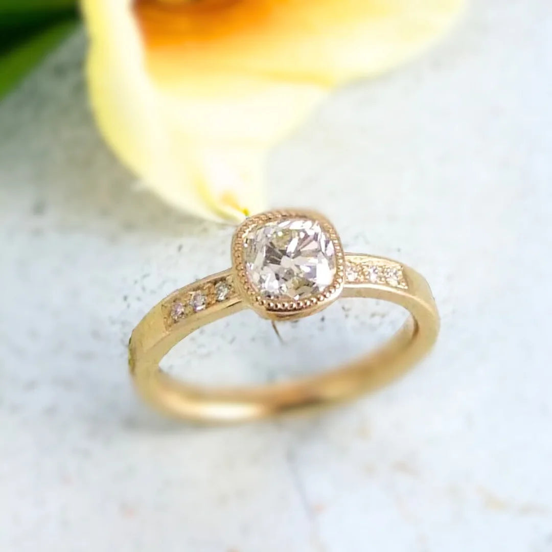 Pavé Diamond Cushion Cut Sapphire Ring: Elegant Sapphire Jewelry featuring a 1.90 CT old mined cushion-cut white diamond center stone, pavé diamond accents, round side diamonds, and a straight shank engagement ring design with vintage-inspired elegance.