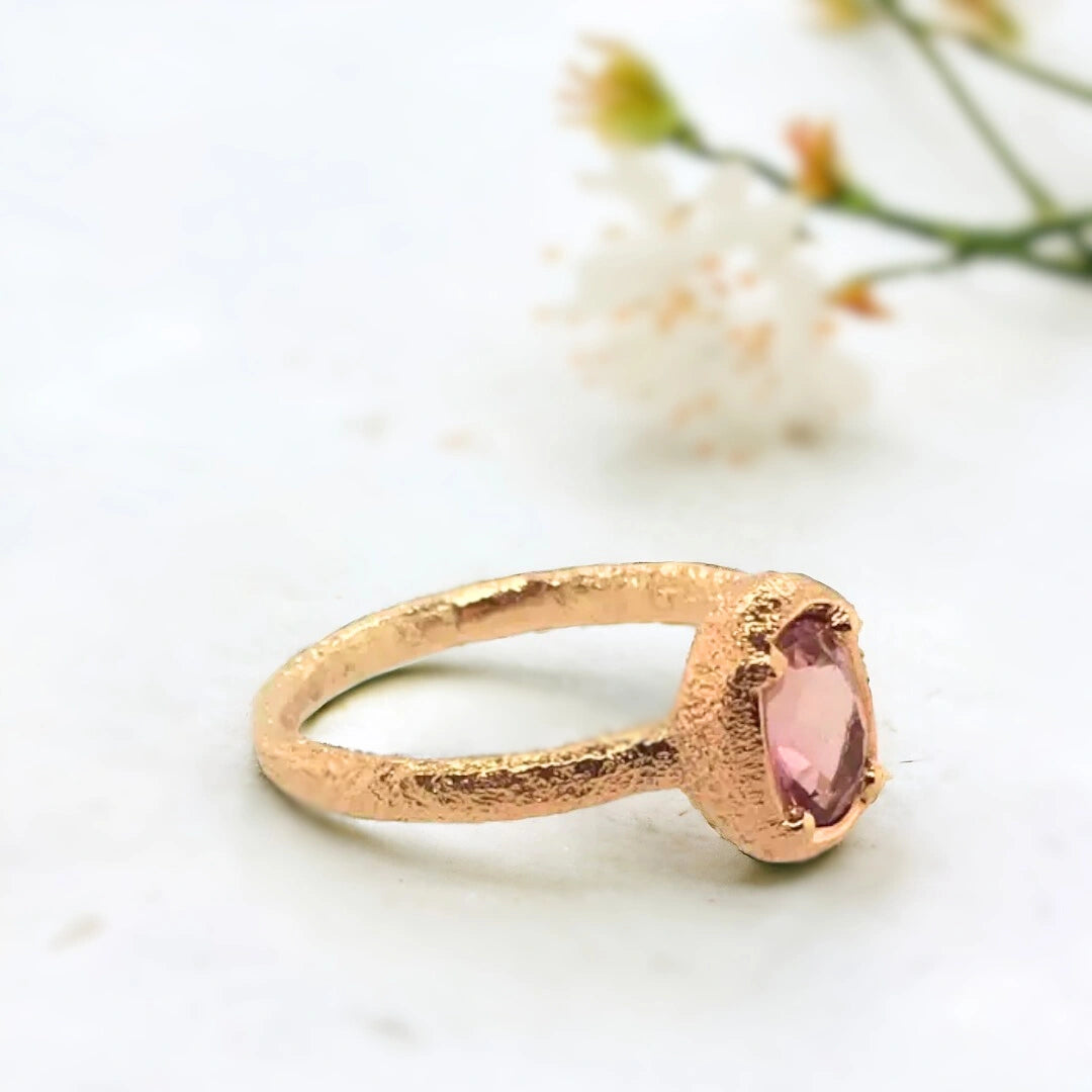 Peach Tourmaline Ring Oval 2.50 Ct Statement Design Elegant, featuring an oval-cut peach tourmaline gemstone with warm blush apricot tones and a soft radiant glow, set on a straight shank handcrafted band with organic texture and minimalist statement style