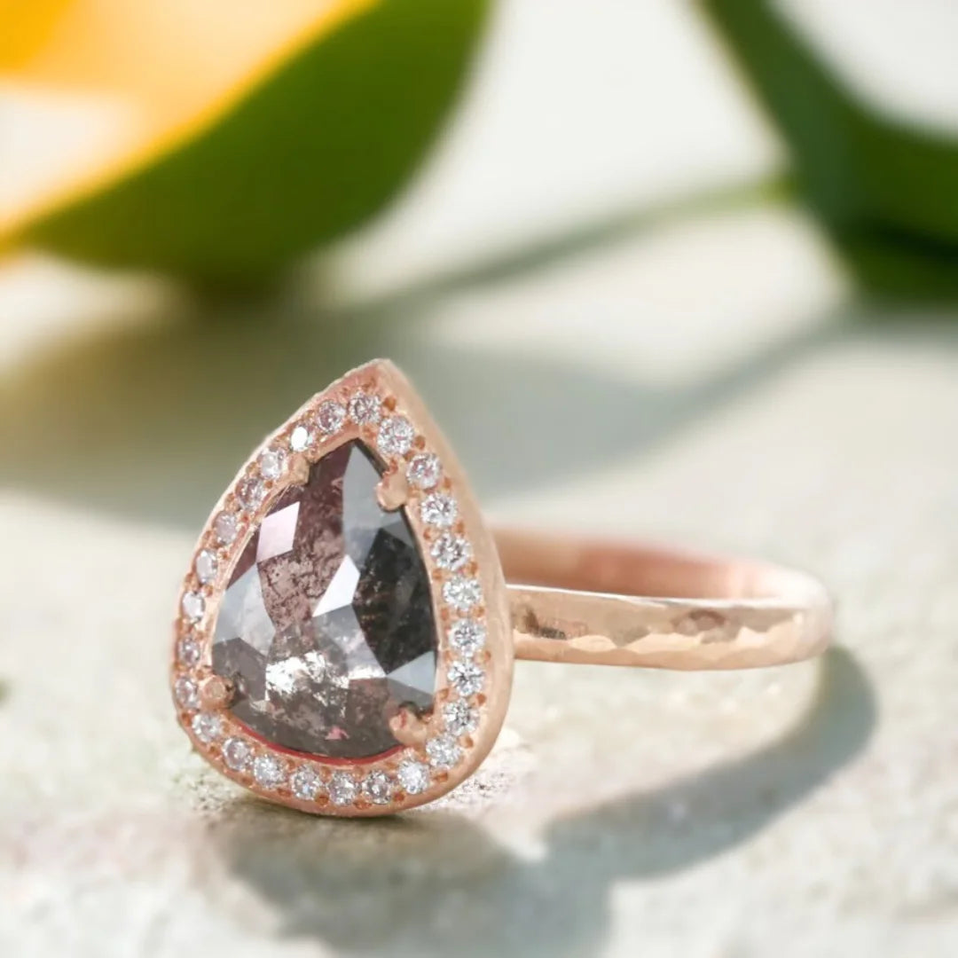 Pear Salt and Pepper Diamond Ring with Vintage-Inspired Sparkle featuring a rose pear-cut salt-and-pepper diamond, round side diamonds, straight shank band, and vintage-inspired artisan design with refined sparkle and symmetry.