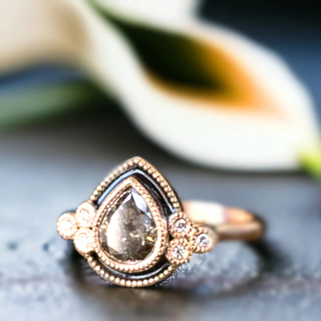Pear Shape Salt and Pepper Diamond Ring Cathedral Custom Style Jewelry featuring a pear-cut salt-and-pepper center diamond with organic natural inclusions, accented by round side stones, set in a cathedral-inspired design with a straight shank band and refined engagement ring style.