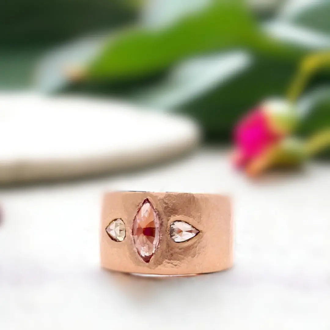 Pink Sapphire Engagement Ring, Marquise Rose Gold Diamond Accents featuring a rose marquise-cut pink sapphire center stone with pear-shaped diamond accents in an elegant organic engagement ring design.