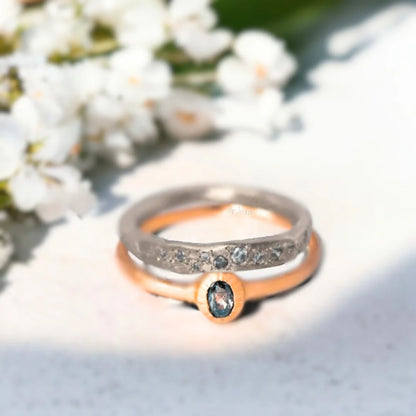 Rose Gold Salt and Pepper Diamond Ring Bezel Design in Rose Gold featuring an oval salt-and-pepper diamond in a bezel setting with a rose gold split shank band and a minimalist handcrafted design.