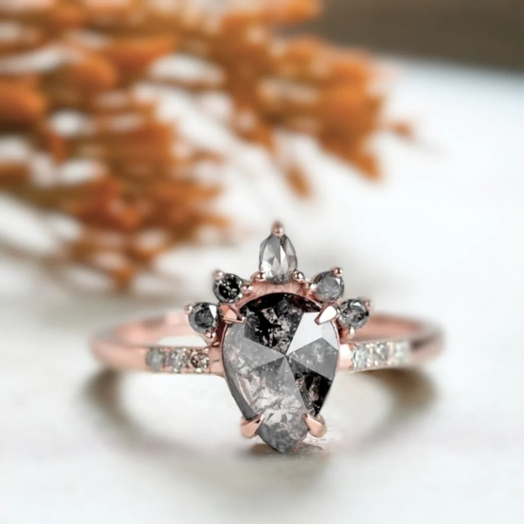 Rose Pear Salt And Pepper Diamond Ring With Grey Diamonds featuring a rose pear cut salt and pepper diamond center stone, grey diamond side stones, straight shank engagement ring design, and a refined vintage-inspired style.