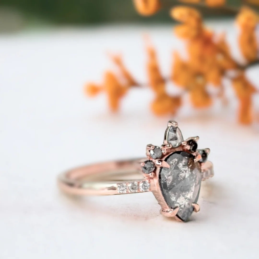 Rose Pear Salt And Pepper Diamond Ring With Grey Diamonds featuring a rose pear cut salt and pepper diamond center stone, grey diamond side stones, straight shank engagement ring design, and a refined vintage-inspired style.