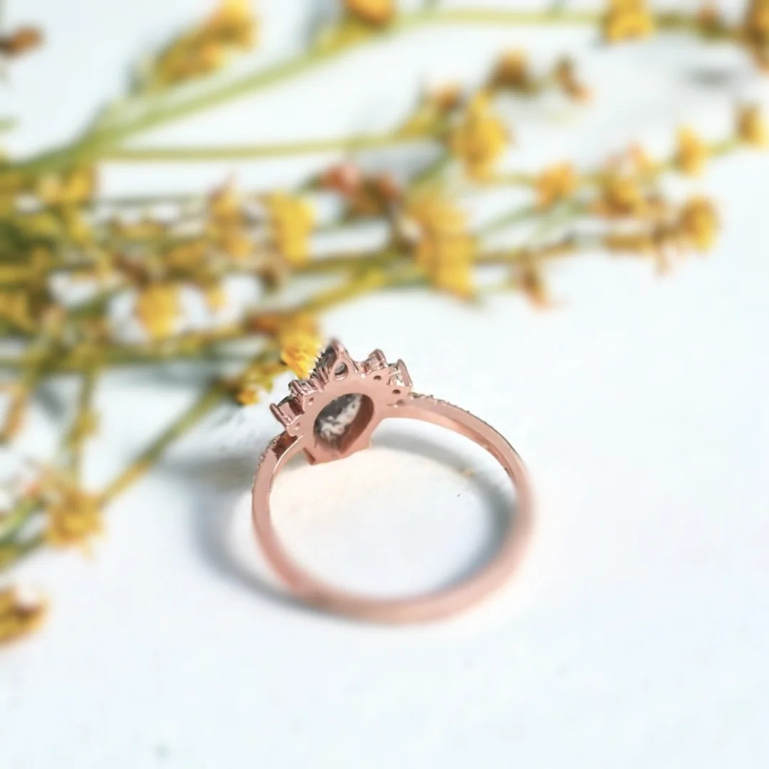 Rose Pear Salt And Pepper Diamond Ring With Grey Diamonds featuring a rose pear cut salt and pepper diamond center stone, grey diamond side stones, straight shank engagement ring design, and a refined vintage-inspired style.