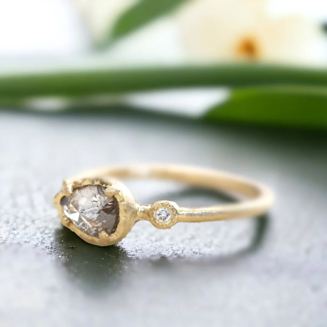 Rose Pear Salt And Pepper Diamond Ring With Side Diamonds featuring a 1.10 CT rose pear cut salt and pepper diamond, round side diamonds, delicate side stone design, straight shank band, and handcrafted engagement ring style.