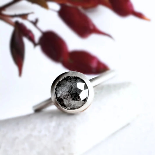 Round Salt and Pepper Diamond Ring, Unique Natural Stone Design featuring a round salt and pepper rose-cut diamond with visible natural inclusions set in a minimalist straight band design with a delicate stackable silhouette and fine handcrafted finish.