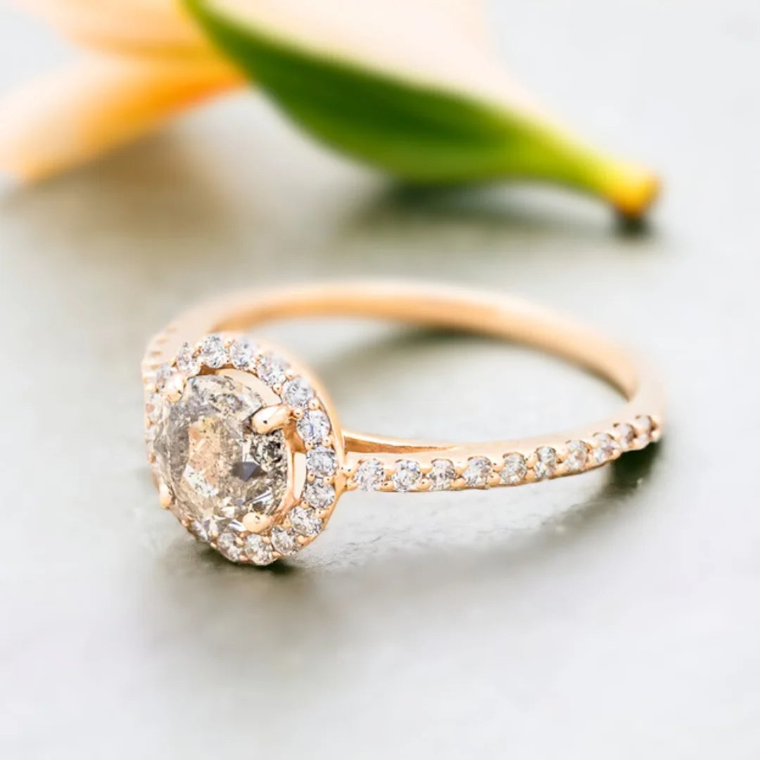Round Salt and Pepper Diamond Halo Engagement Ring Felice Design featuring a round-cut salt-and-pepper diamond center stone surrounded by a halo of round accent diamonds in a halo engagement ring setting with a tapered shank band and elegant fine jewelry design.