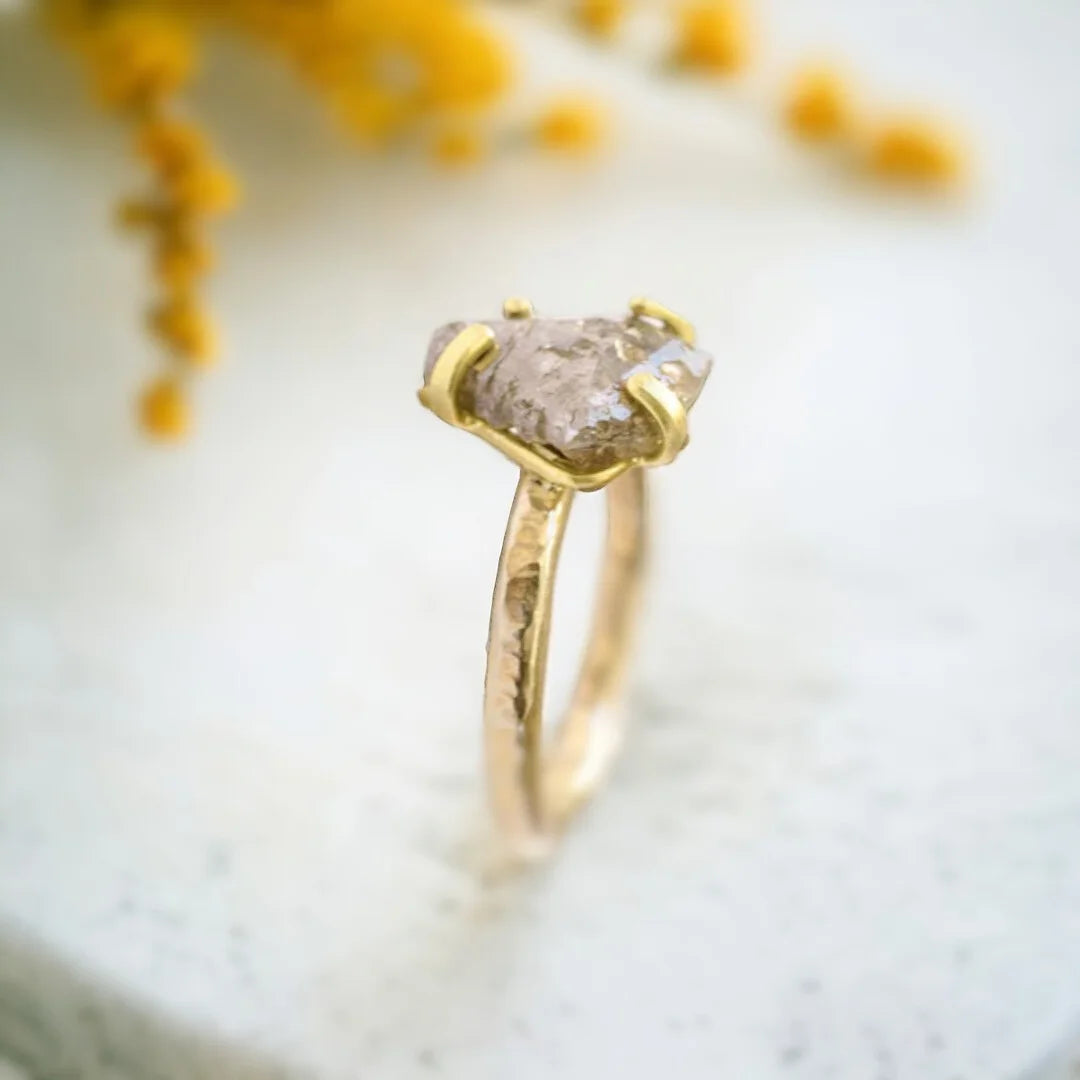Raw Salt and Pepper Diamond Ring Rustic Hammered Gold Grey Diamond featuring a hammered gold band, slim straight shank, and a raw uncut grey salt and pepper diamond set in a bold minimalist rustic design