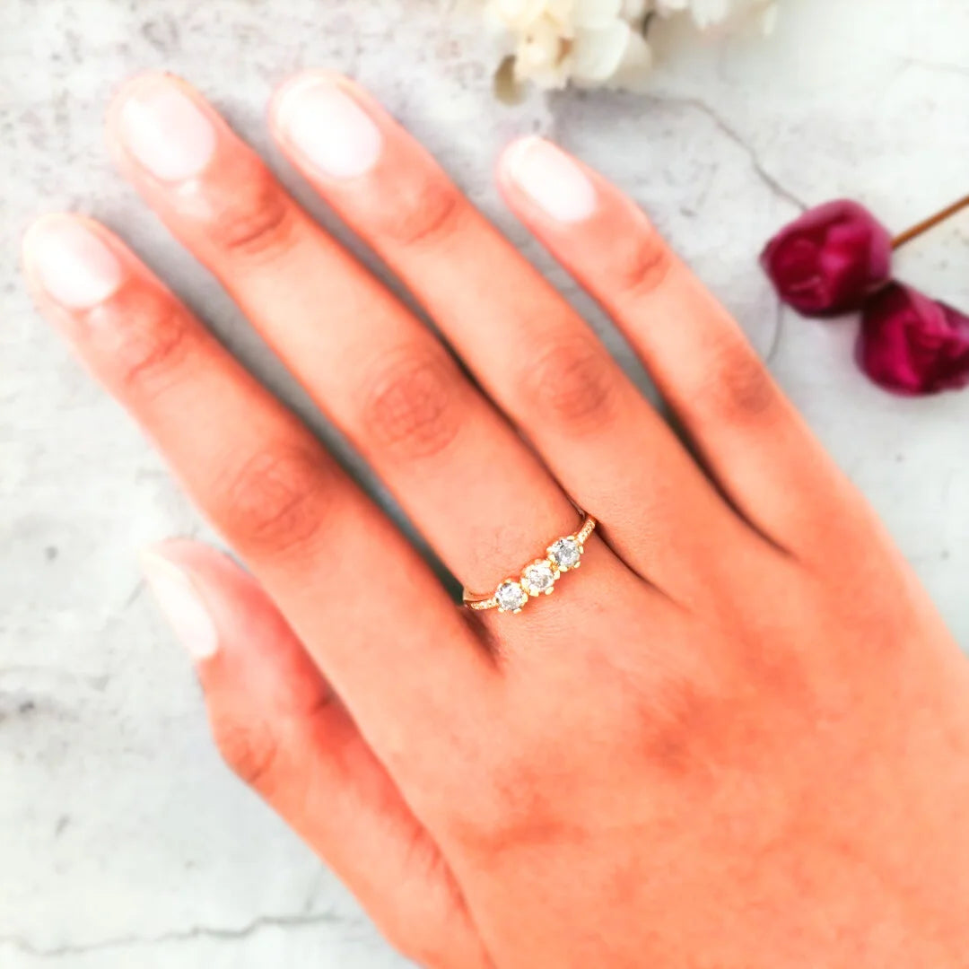 Salt and Pepper Diamond Juliet Ring with Round Cut Diamond featuring a round cut grey tone salt and pepper diamond, round side diamonds, minimalist contemporary setting, straight shank, and handcrafted organic-textured fine diamond ring.