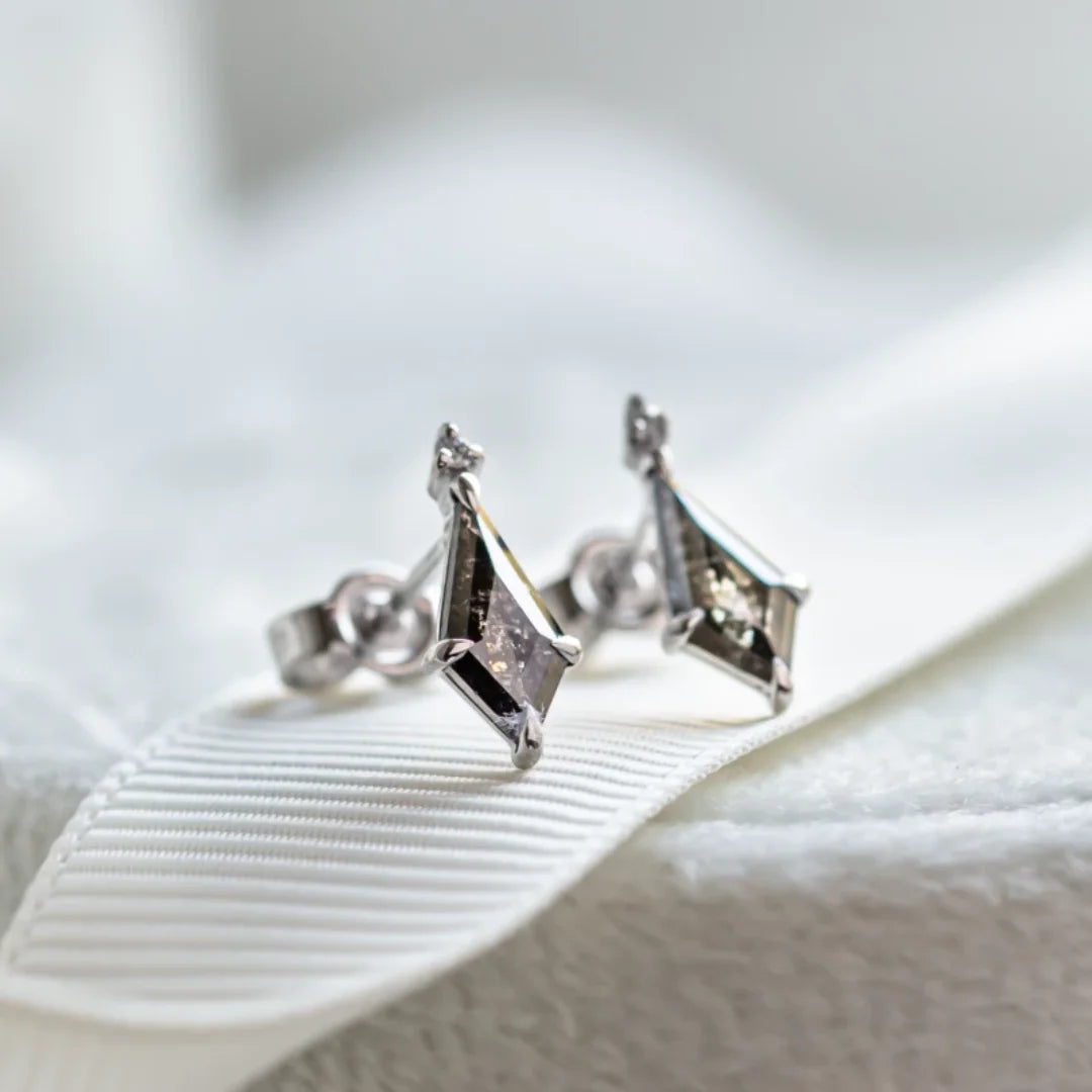 Salt And Pepper Diamond Kite Earrings White Gold Stud Earrings featuring kite cut salt and pepper diamonds in a geometric minimalist stud earring design with a white gold setting and secure screw back style.