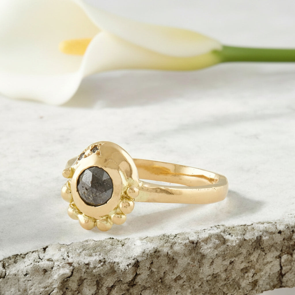 Salt and Pepper Diamond Ring with Accent Diamond Design featuring a round rose-cut salt-and-pepper diamond centre stone with grey round side diamonds in an elegant diamond ring setting.