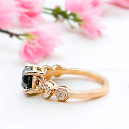 Salt and Pepper Diamond Ring Black Celestial Sun Moon Star Design featuring a round-cut salt-and-pepper diamond centre stone with galaxy-inspired inclusions, accented by round side diamonds in a celestial sun moon star themed ring design with a straight shank and fine band detailing