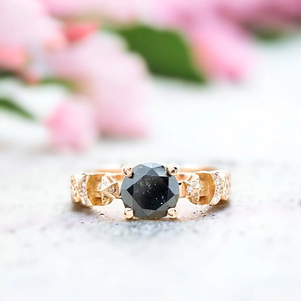 Salt and Pepper Diamond Ring Black Celestial Sun Moon Star Design featuring a round-cut salt-and-pepper diamond centre stone with galaxy-inspired inclusions, accented by round side diamonds in a celestial sun moon star themed ring design with a straight shank and fine band detailing