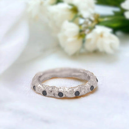 Salt and Pepper Diamond Ring Gold Foil Blue Sapphire Stacking Rings featuring round-cut salt-and-pepper diamonds with white diamond accents in a gold stacking ring design with dual bands and a straight shank setting.