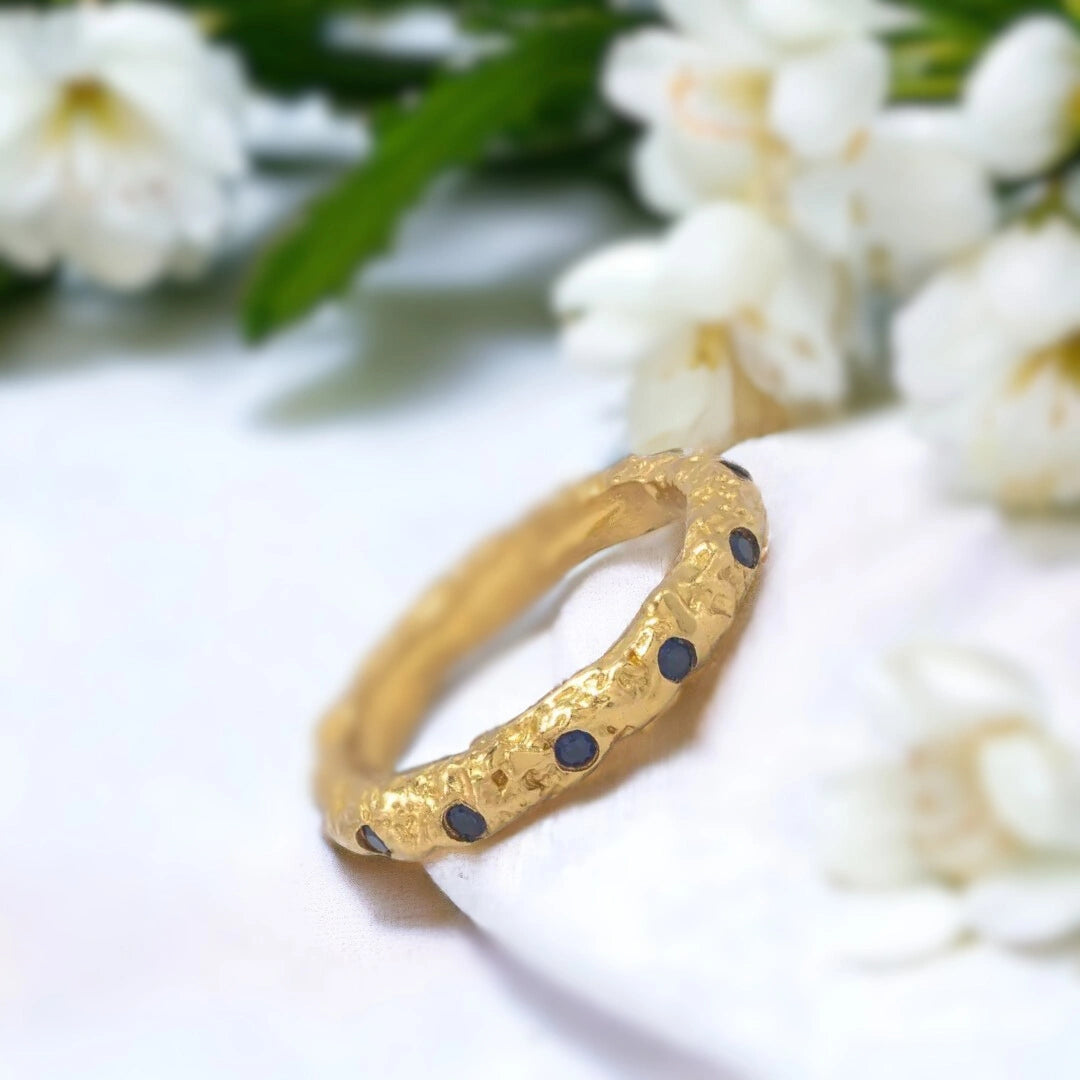 Salt and Pepper Diamond Ring Gold Foil Blue Sapphire Stacking Rings featuring round-cut salt-and-pepper diamonds with white diamond accents in a gold stacking ring design with dual bands and a straight shank setting.