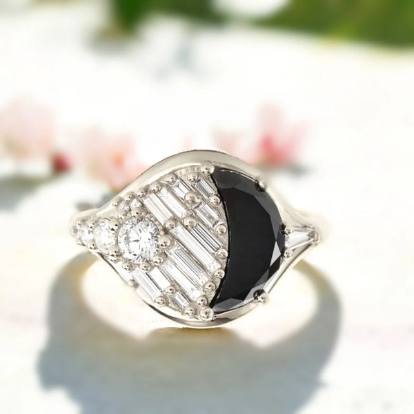 Salt and Pepper Diamond Ring New Moon Jet Black Diamond Ring featuring a half moon salt and pepper diamond with baguette and round accent stones set in a modern geometric handcrafted design with a slim polished band