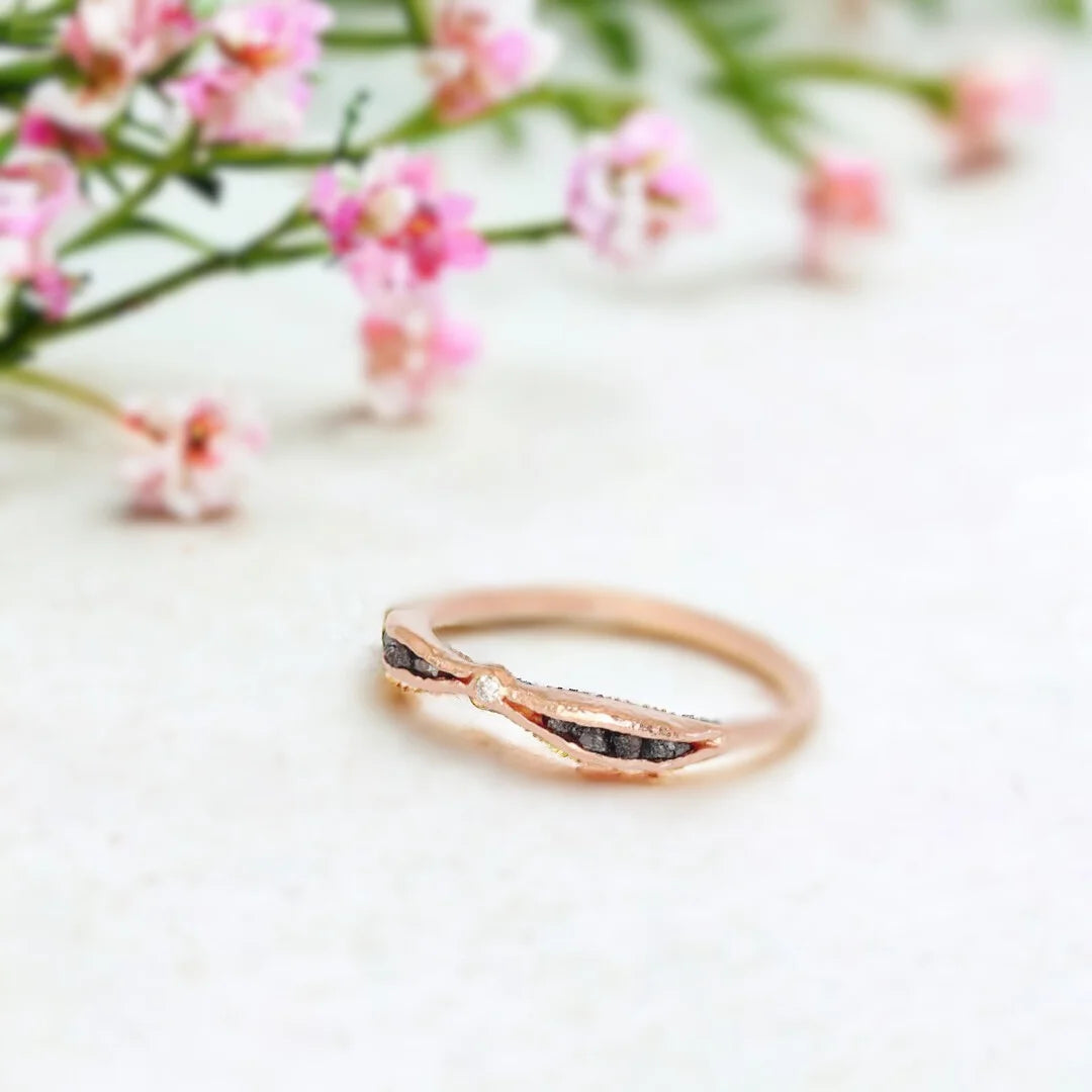 Salt and Pepper Diamond Ring Rose Gold Diamond Chip Ring featuring a round-cut salt-and-pepper diamond in a rose gold slim band with uncut dark brown side stones and an organic textured design