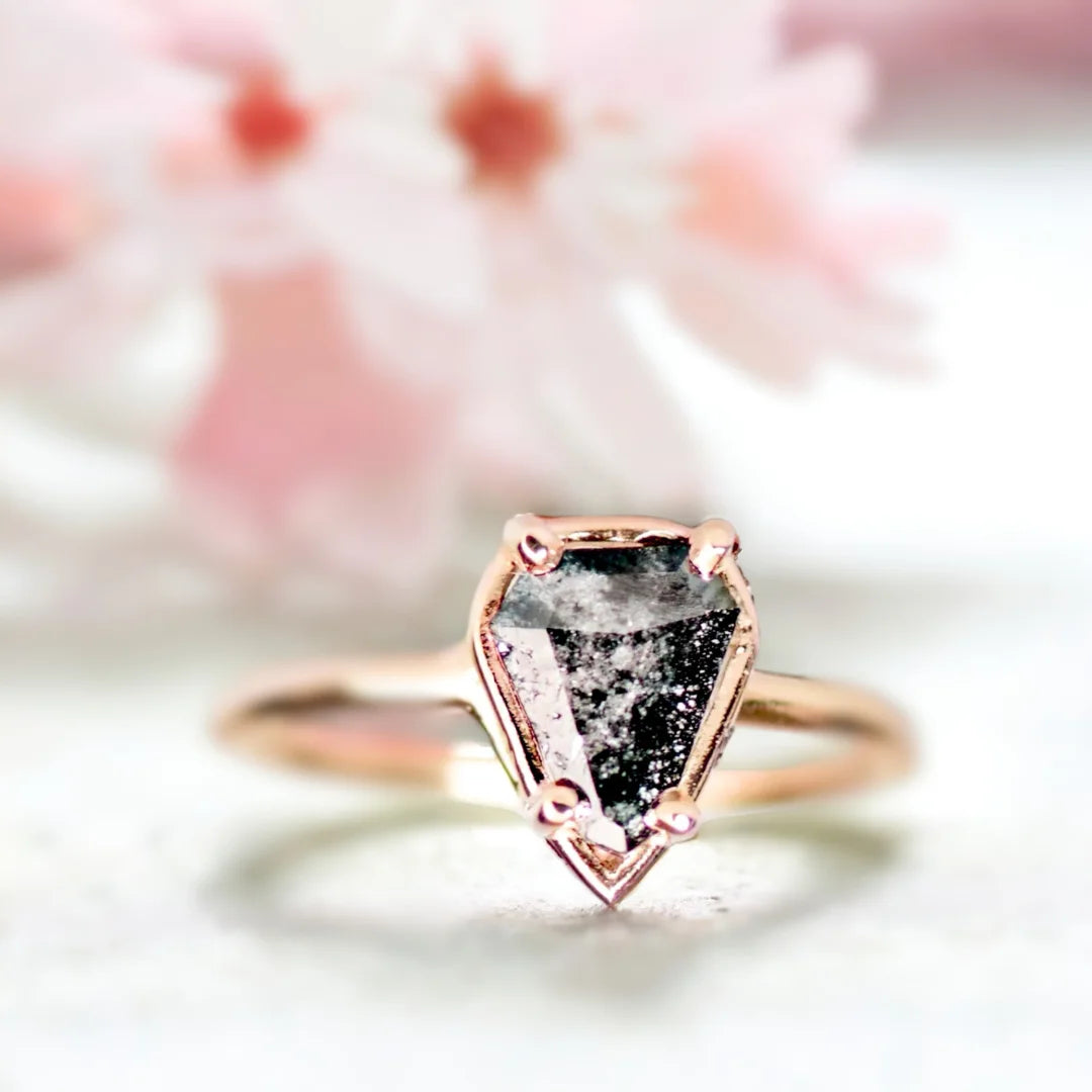 Salt and Pepper Diamond Ring Shield Cut 1.10 Ct Minimalist Ring featuring a shield-cut 1.10 ct natural salt and pepper diamond set on a slim straight band with minimalist geometric styling and visible organic inclusions in a refined handcrafted design