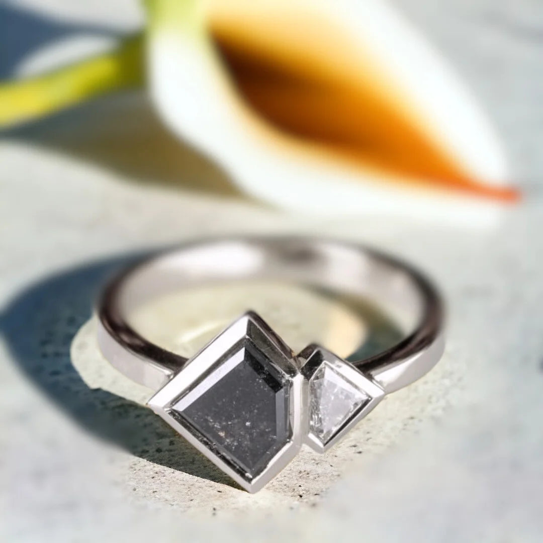 Salt and Pepper Diamond Ring Double Shield Diamond Design featuring a 1.18 CT shield-cut salt-and-pepper diamond with grey shield-shaped side diamonds in a geometric statement ring design with a straight shank band.