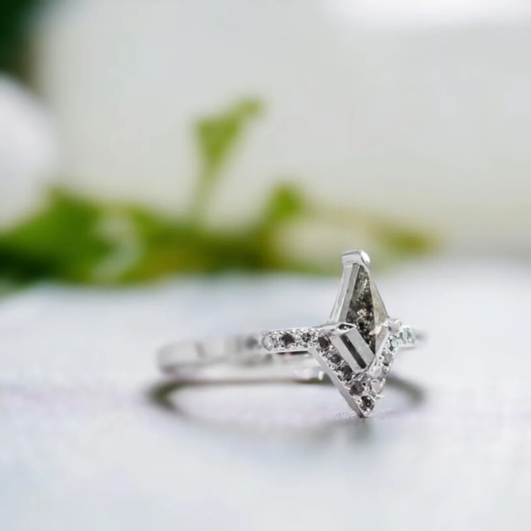 Kite Cut Salt and Pepper Diamond Engagement Ring featuring a kite-cut salt-and-pepper diamond center stone with black round accent diamonds arranged in a modern engagement ring design, showcasing a bold geometric aesthetic and contemporary fine jewelry style