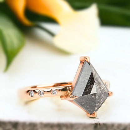 Salt and Pepper Kite Diamond Engagement Ring with 3.10 CT Diamond featuring a kite-cut salt-and-pepper diamond center stone with round side diamonds, side-stone engagement ring design, straight shank band, and a contemporary geometric style.