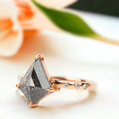 Salt and Pepper Kite Diamond Engagement Ring with 3.10 CT Diamond featuring a kite-cut salt-and-pepper diamond center stone with round side diamonds, side-stone engagement ring design, straight shank band, and a contemporary geometric style.