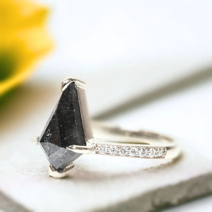 Salt and Pepper Kite Diamond Ring Athena Handcrafted Unique Jewelry featuring a kite-cut salt-and-pepper diamond in a white metal ring with round side diamonds, side stone accent setting, straight shank band, and contemporary geometric design.