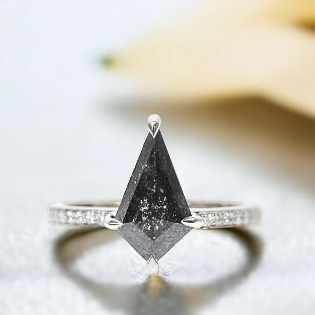 Salt and Pepper Kite Diamond Ring Athena Handcrafted Unique Jewelry featuring a kite-cut salt-and-pepper diamond in a white metal ring with round side diamonds, side stone accent setting, straight shank band, and contemporary geometric design.