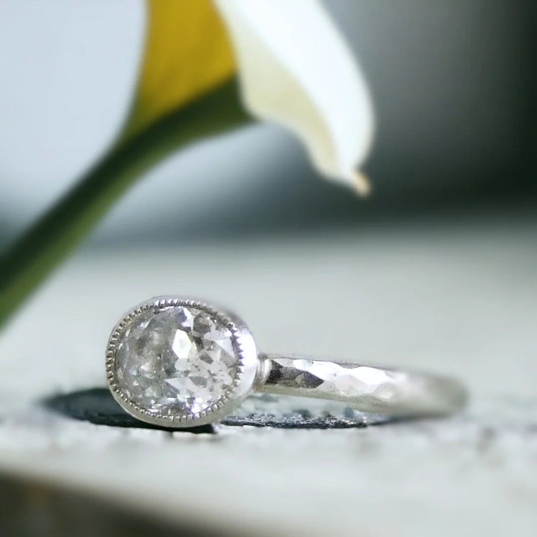 Salt and Pepper Oval Diamond Ring, Old Mine Cut Galaxy Whirl Design featuring an oval salt and pepper diamond with a 1.30 CT center stone, set in a straight shank band with Galaxy Whirl Design detailing, showcasing a handcrafted modern vintage fusion style with organic inclusions and an elegant curved oval shape.