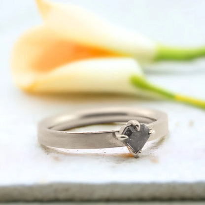Salt and Pepper Shield Cut Diamond Ring Nebula Raindrop Design featuring a shield-cut salt and pepper diamond set in a minimal straight shank band with geometric modern styling and handcrafted artisan detailing.