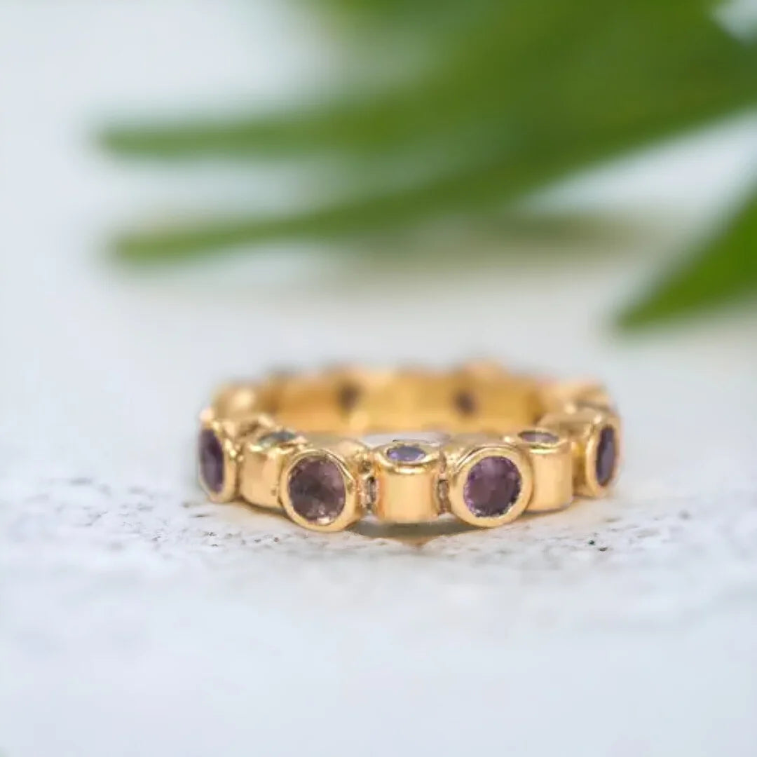 Sapphire and Ruby Band Ring with Natural Blue Sapphires featuring round and rose-cut blue sapphires and ruby accents in a handcrafted band ring design with a straight shank.