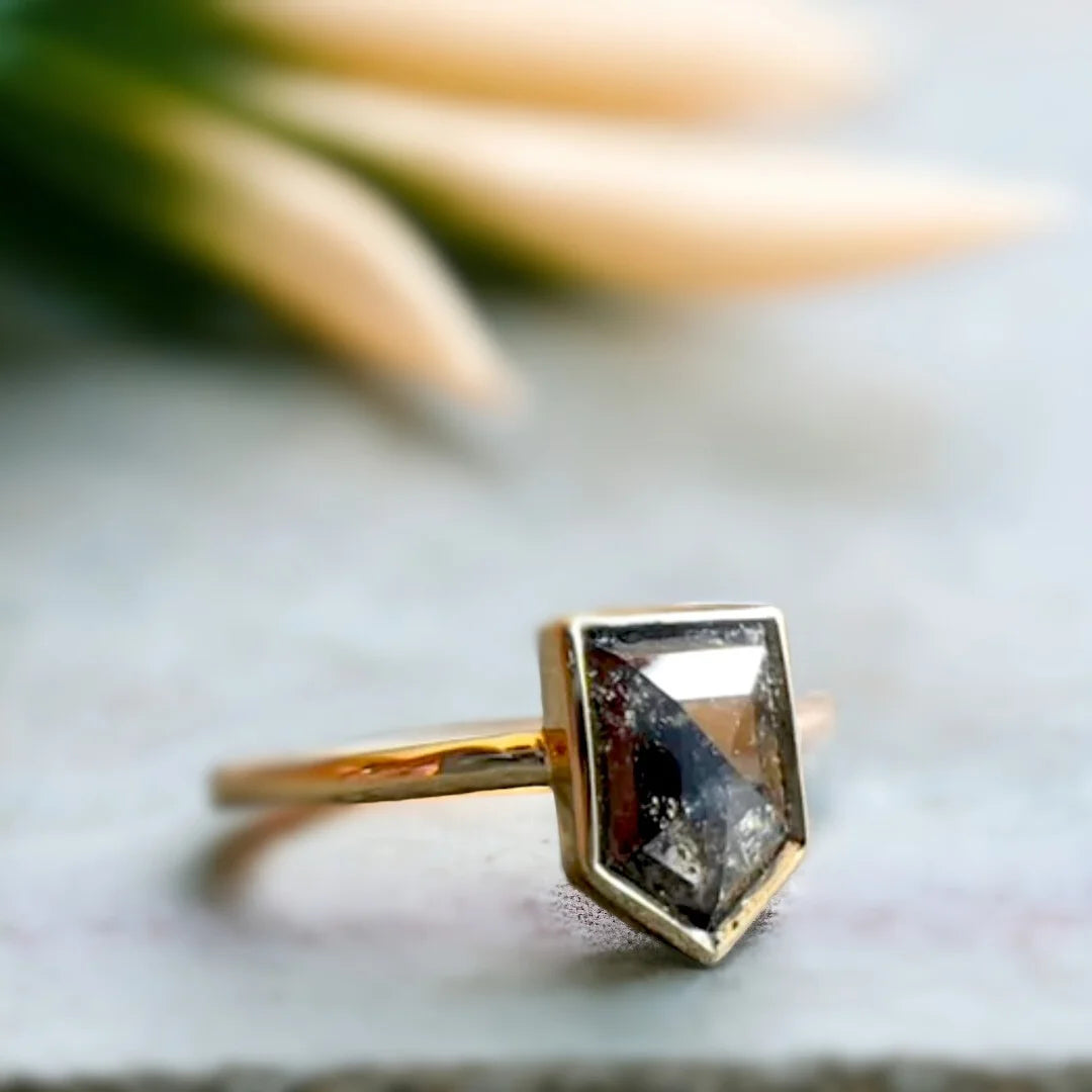 Shield Salt and Pepper Diamond Ring Amethyst Shield Cut Design featuring a shield-cut salt-and-pepper diamond with 1.28 ct center stone set in a geometric minimalist design with straight shank band and refined artisan craftsmanship