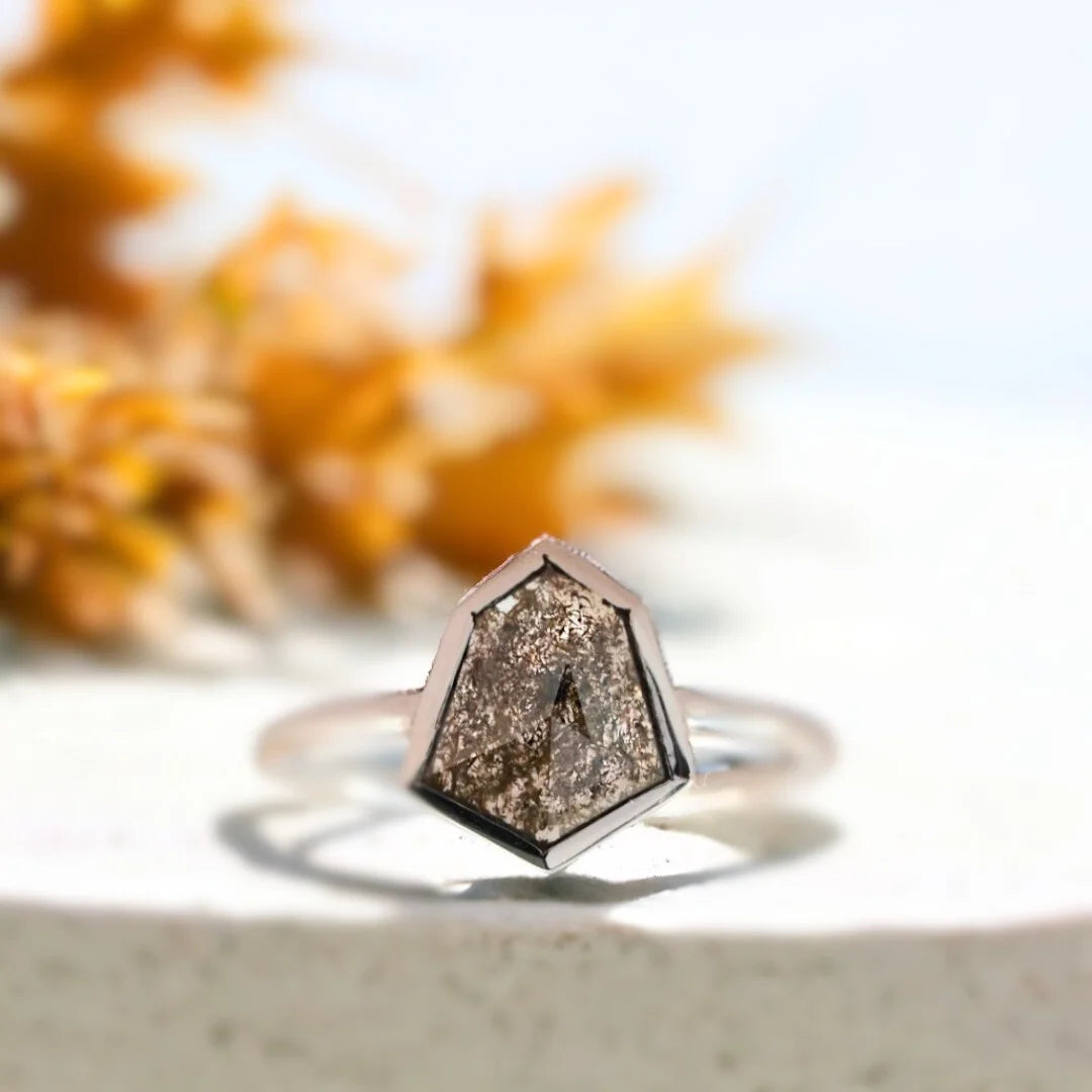 Shield Salt And Pepper Diamond Ring With 1.35 CT Shield Cut Stone featuring a natural shield cut salt and pepper diamond in a solitaire setting with a straight shank band and modern minimalist ring design.