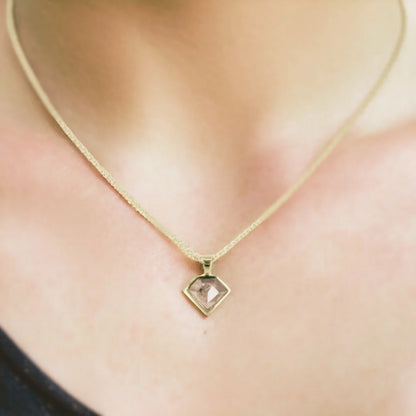 Shield Shaped Salt and Pepper Diamond Pendant features a shield-shaped pendant showcasing a natural grey salt-and-pepper diamond with a soft, elegant appeal. The design highlights a delicate chain and handcrafted artisan styling with a refined, minimalist look suitable for everyday wear.