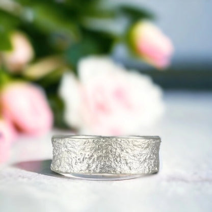 Sands of Time Wedding Band with Ocean Wave Design Solid Gold Wedding Band featuring a 7.5mm wide solid gold band with ocean wave-inspired layered handcrafted texture, straight shank design and smooth comfort fit unisex statement style ring