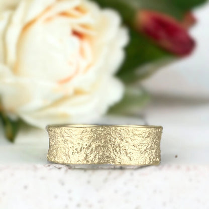 Sands of Time Wedding Band with Ocean Wave Design Solid Gold Wedding Band featuring a 7.5mm wide solid gold band with ocean wave-inspired layered handcrafted texture, straight shank design and smooth comfort fit unisex statement style ring