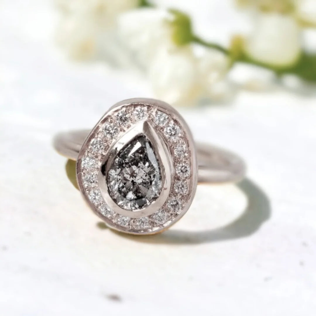 Victorian Salt and Pepper Diamond Ring Timeless Design With Vintage Charm featuring a natural grey round salt-and-pepper diamond, sparkling round side diamonds, and a Victorian-inspired ring design with a straight shank band and vintage-style detailing.